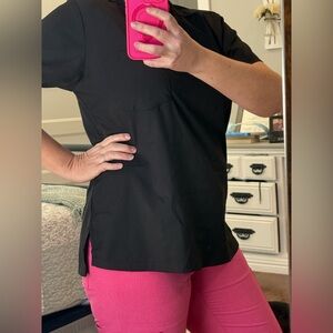 Wink Boundless, modern fit black 1 pocket scrub top. Size medium.